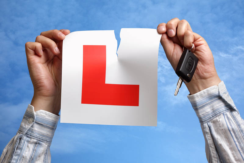 Tearing up L plate after passing driving test learner plates